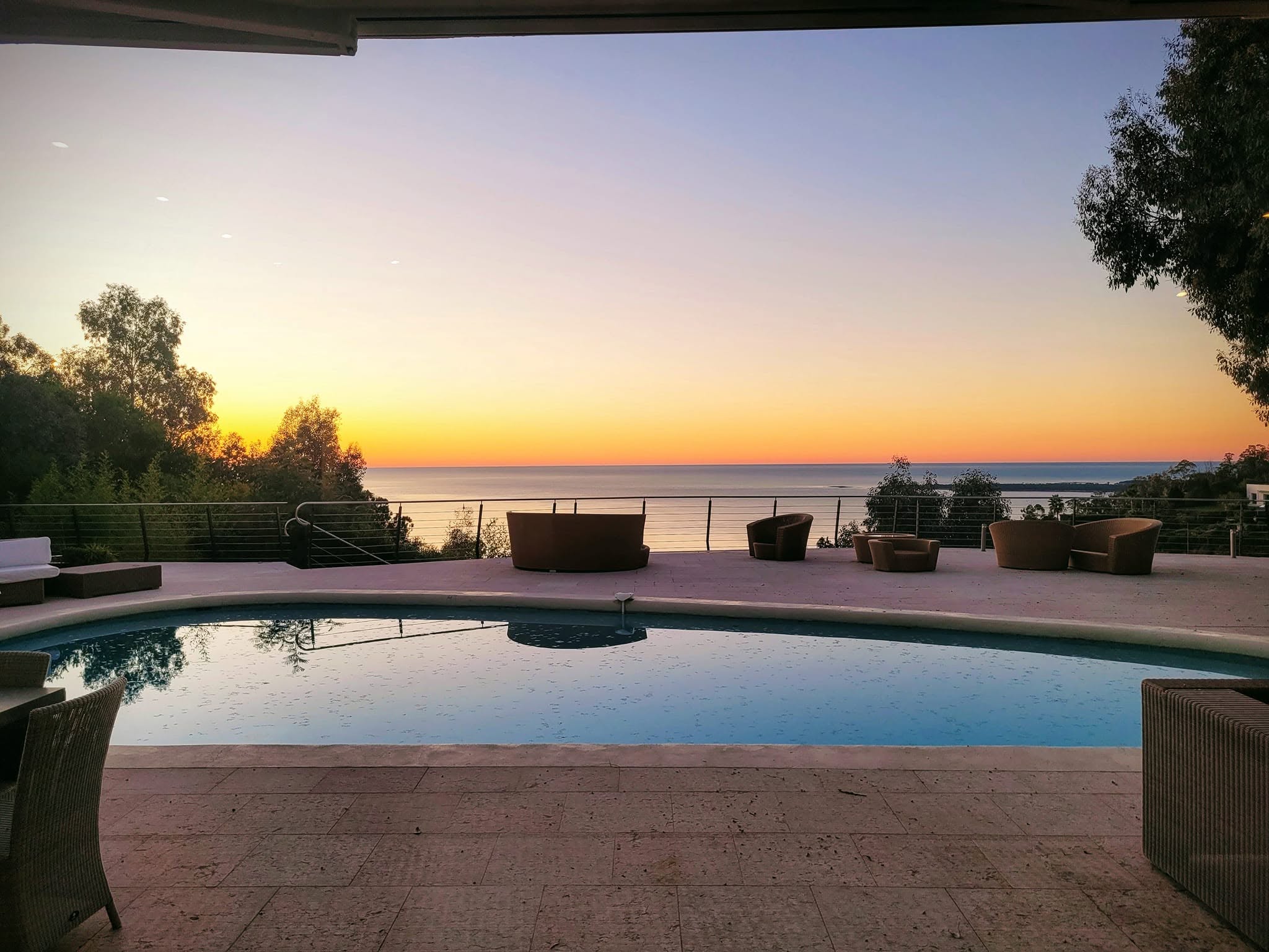 Sunset over the Mediterranean from the pool at Villa Oxygène